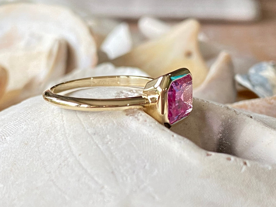 East West Emerald Cut Pink Topaz Ring