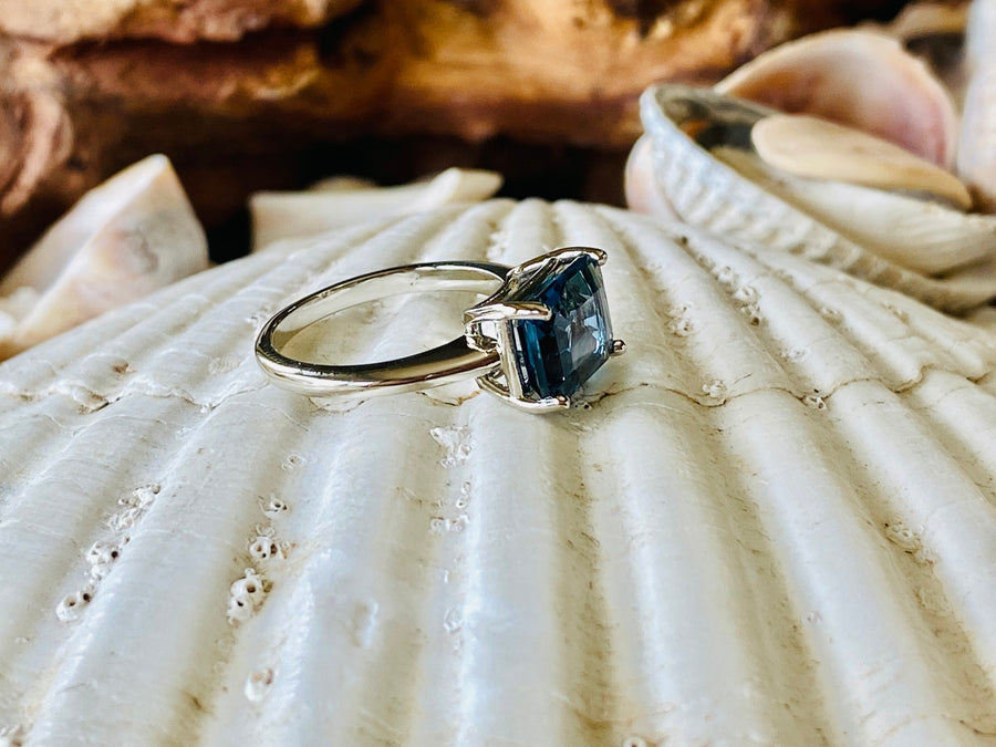 East West Emerald Cut London Blue Topaz Solitaire Ring
