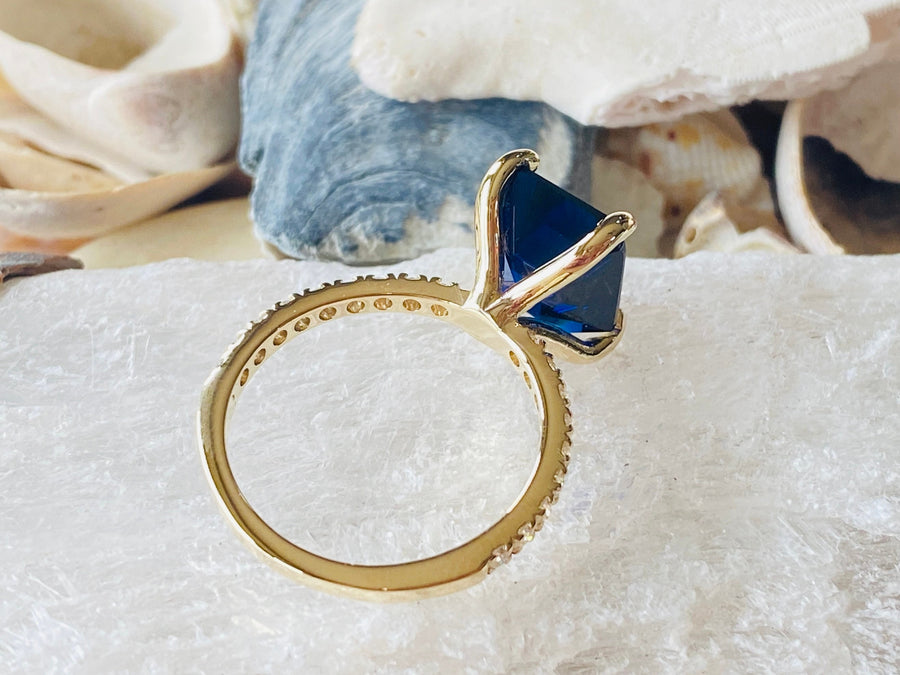 Gold Emerald Cut Sapphire Engagement Ring