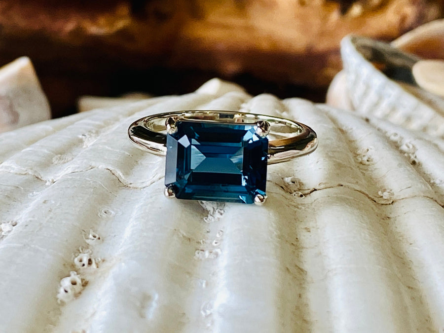 East West Emerald Cut London Blue Topaz Solitaire Ring