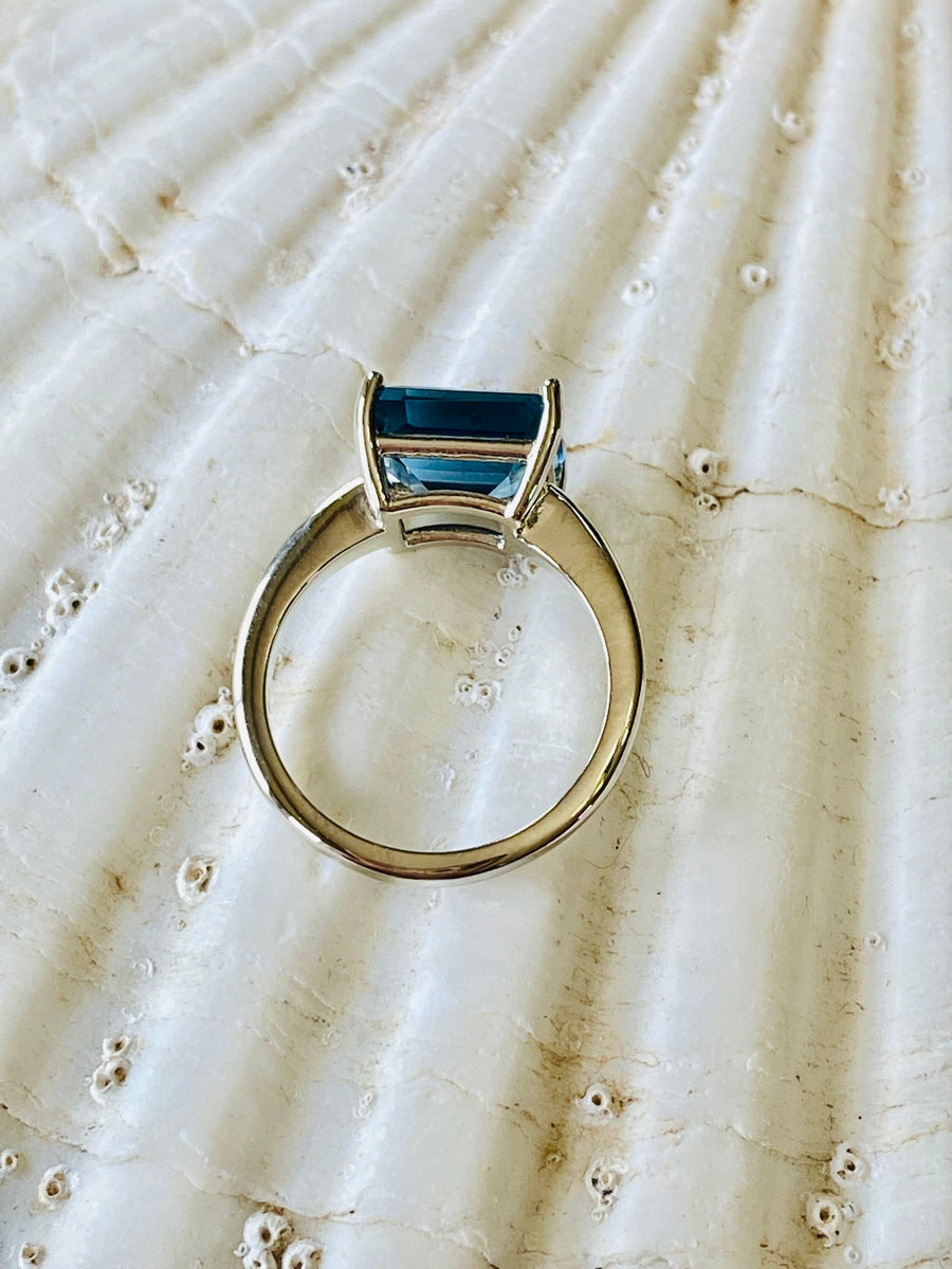 East West Emerald Cut London Blue Topaz Solitaire Ring