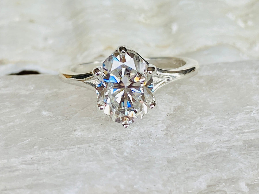 Oval Moissanite Solitaire Trellis Setting Engagement Ring