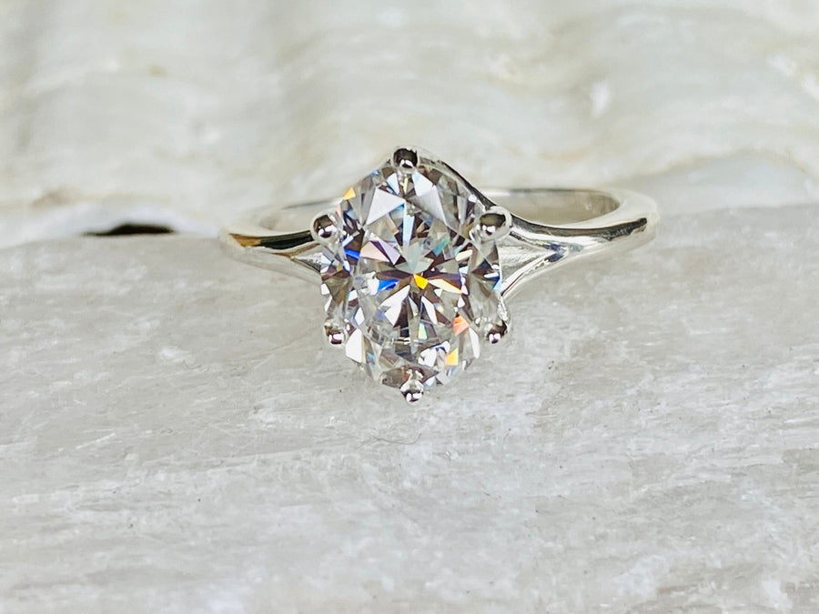 Oval Moissanite Solitaire Trellis Setting Engagement Ring