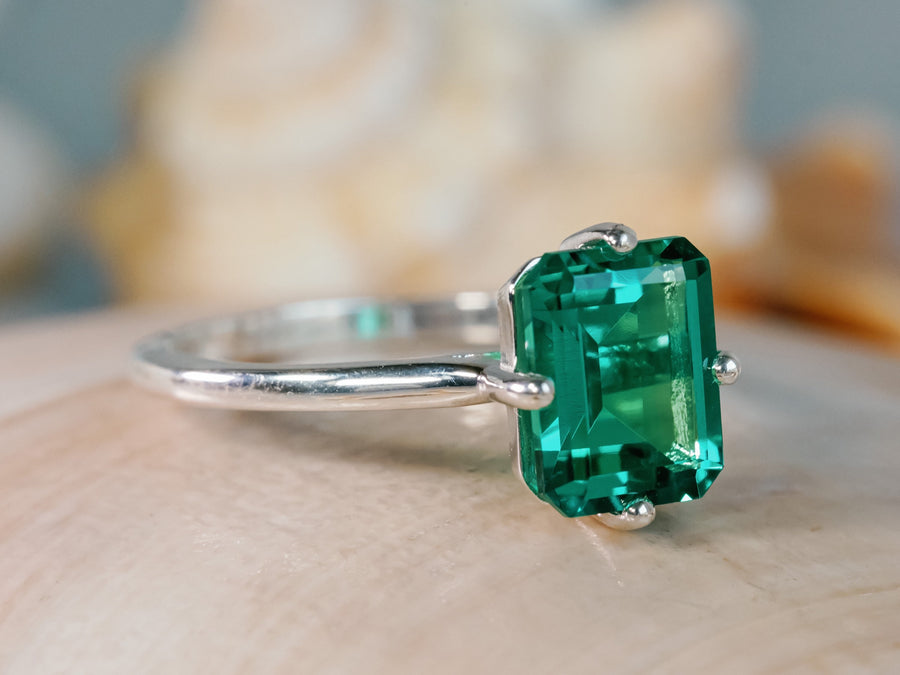 white gold emerald ring side angle jpg